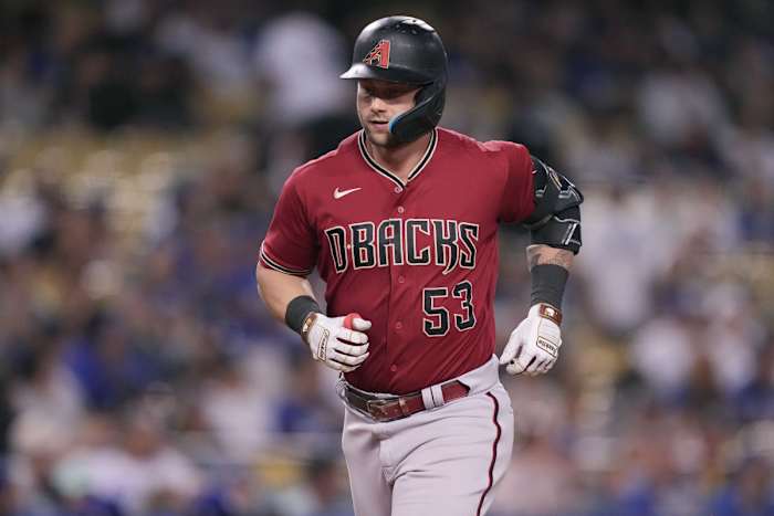 Walker rounds the bases after hitting a solo home run.